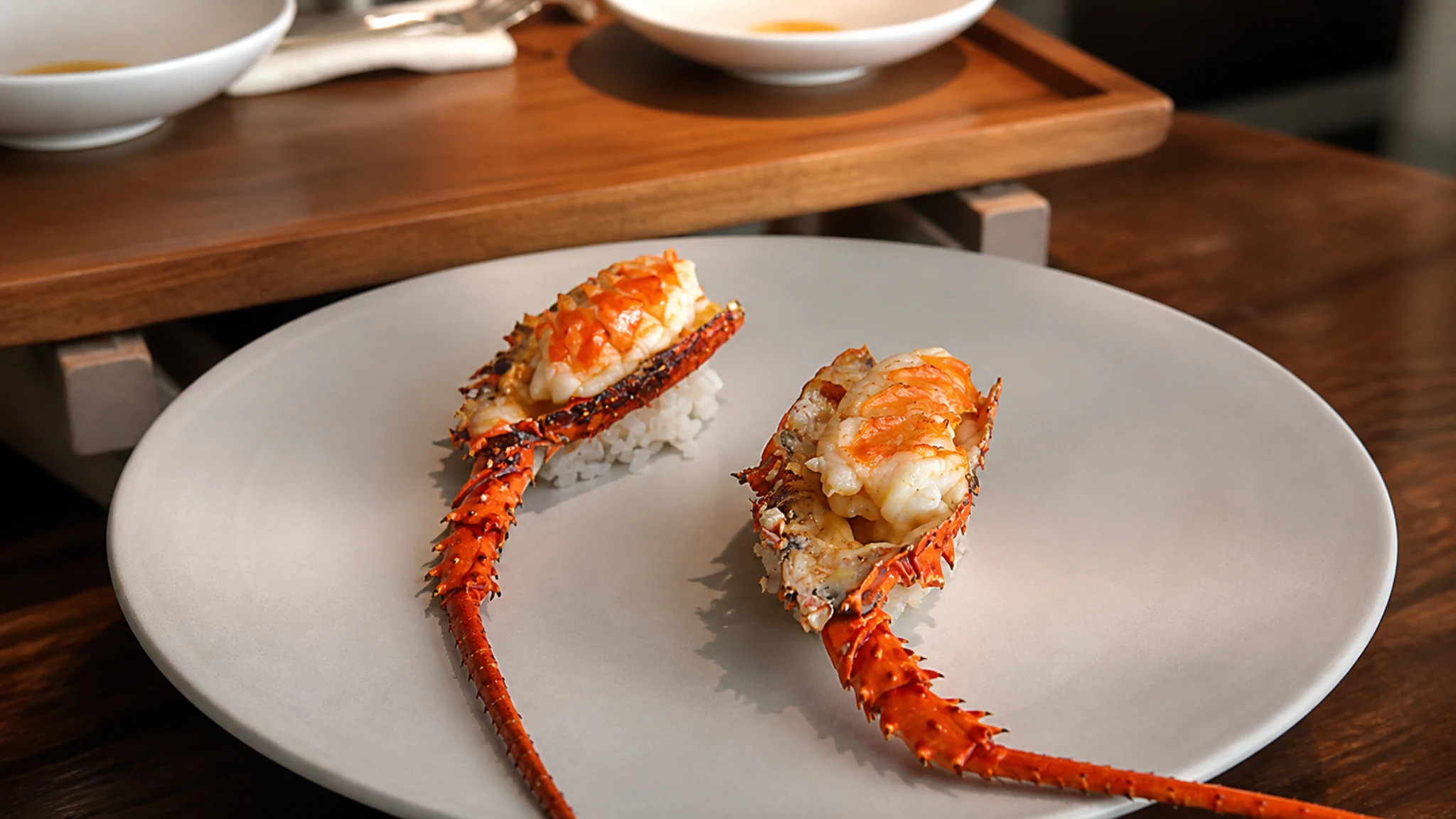 ESqUISSE Tokyo lobster seafood tasting dish with sauce and herbs