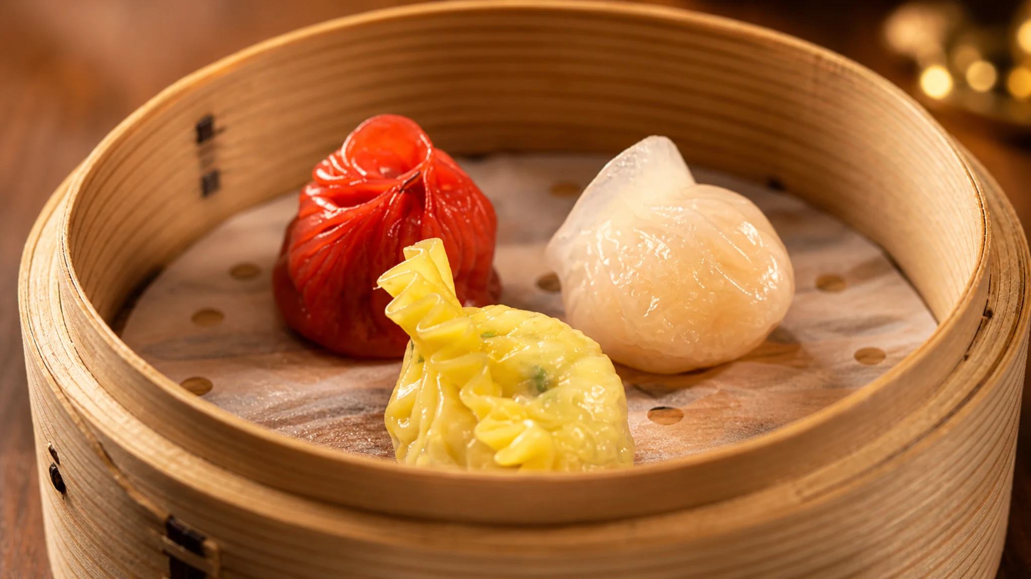Series Tokyo colorful dumpling course served in a bamboo steamer