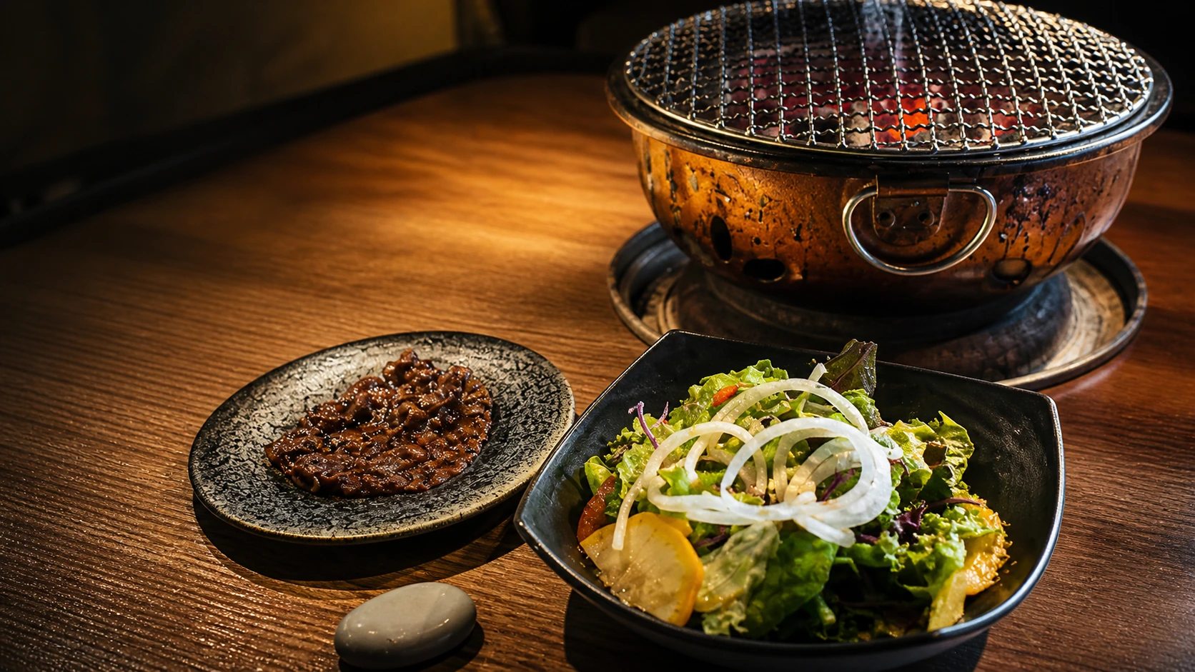 Sumibi Yakiniku Nakahara Tokyo grilled wagyu beef course served on a dark plate