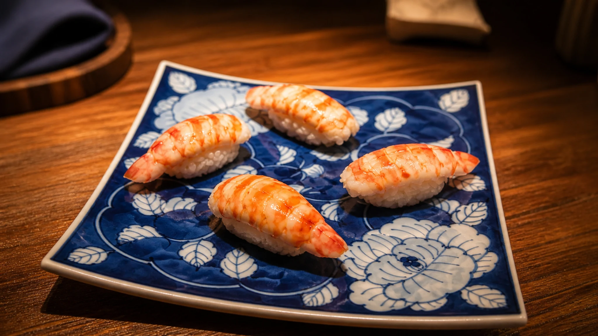 Udatsu Sushi Tokyo nigiri sushi selection served on a blue patterned plate