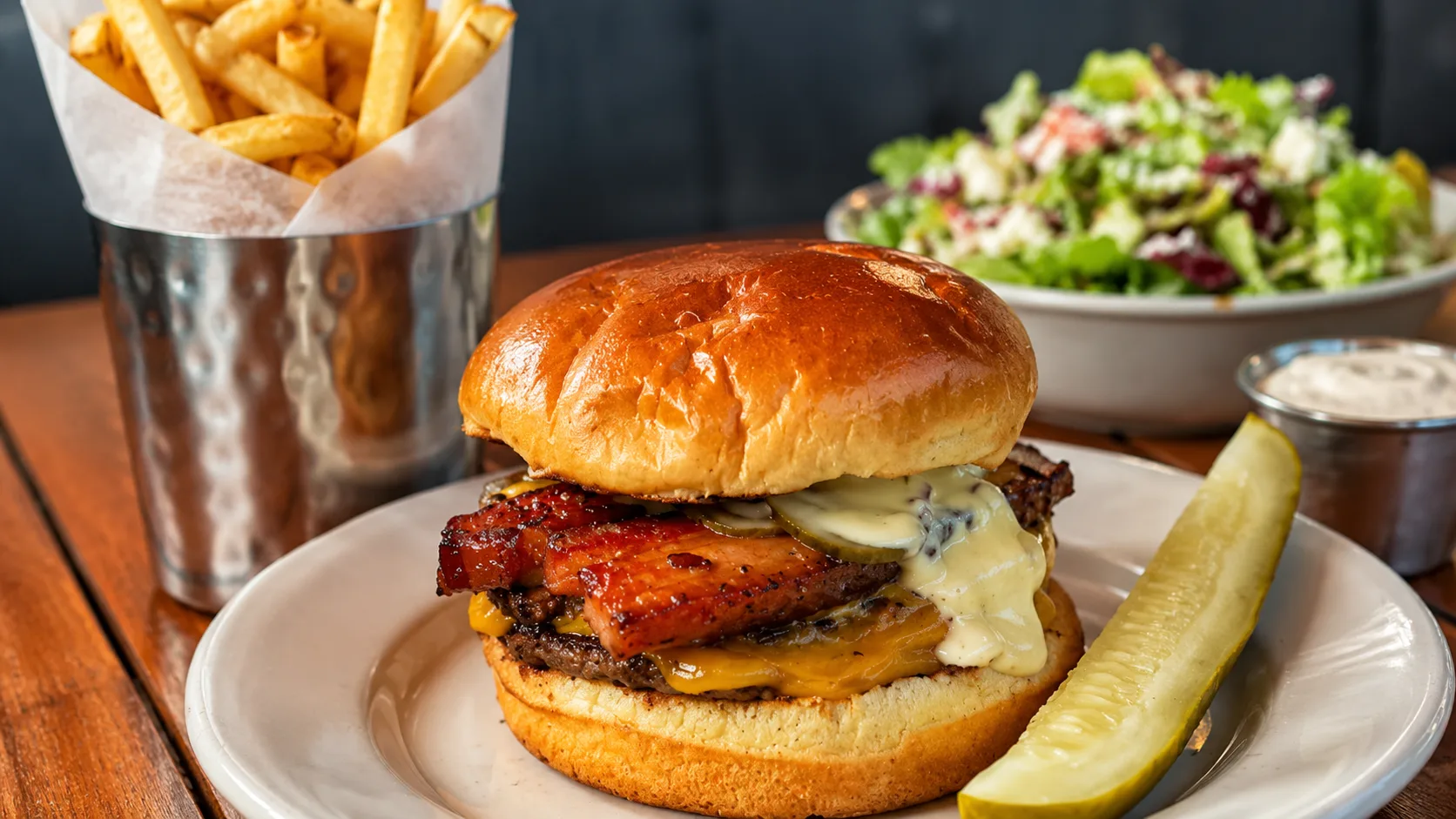 Au Cheval cheeseburger with fries and salad in Chicago