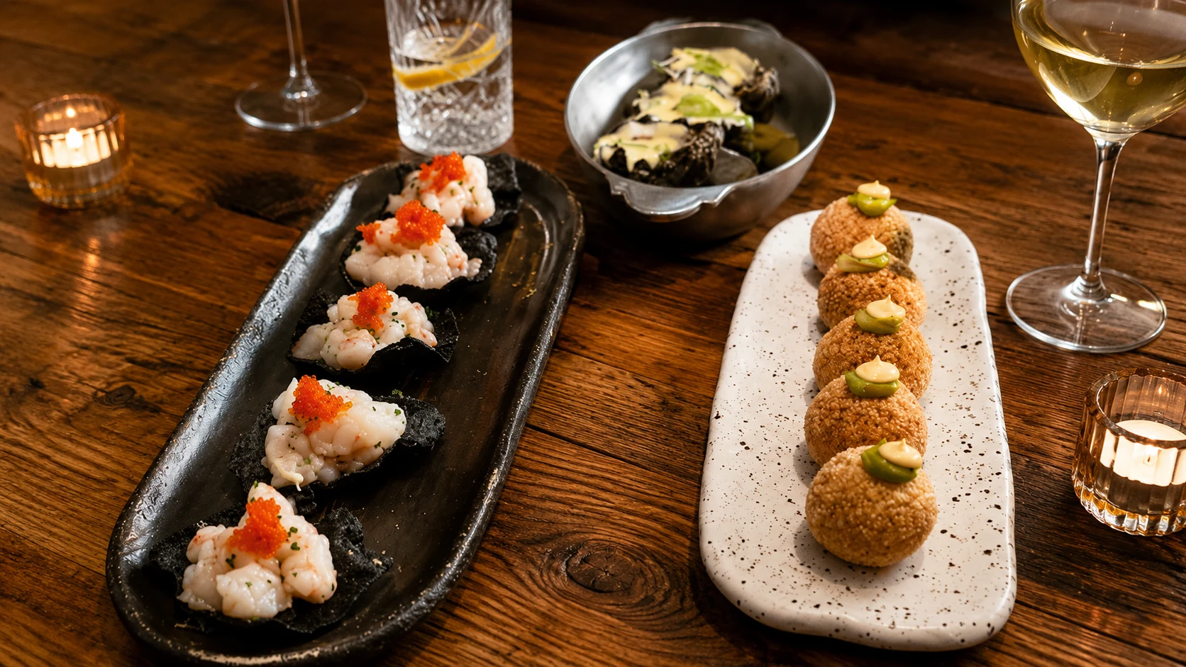 Bàbula Bar 1937 Barcelona tapas, croquettes, salad, and wine on a table