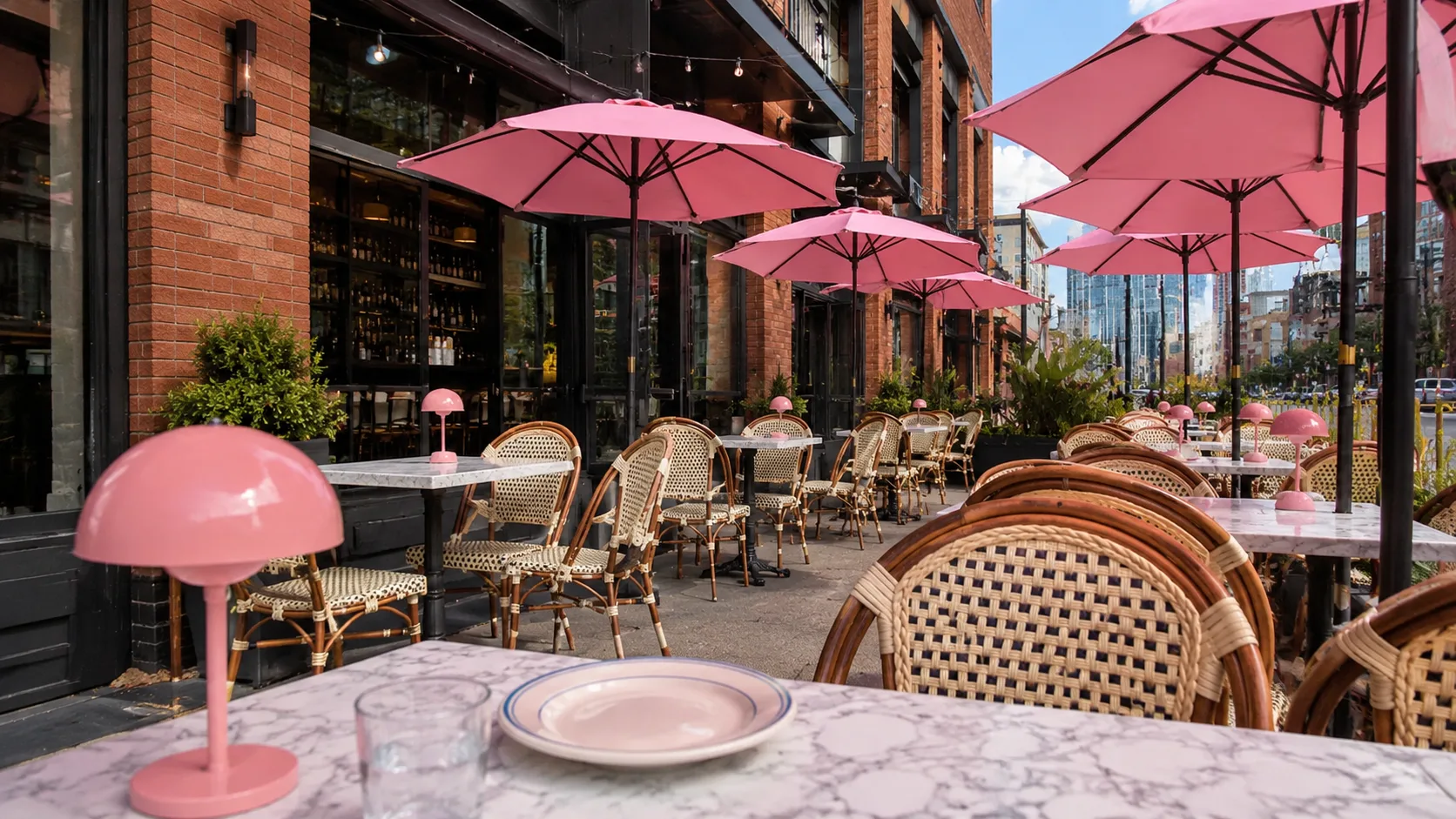 Pink umbrella patio seating at Bar La Rue in Fulton Market Chicago