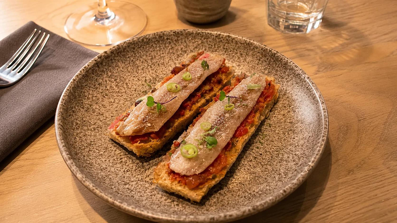 Bocanariz Wine Bar Barcelona wine bar table with tapas, red wine, and small plates