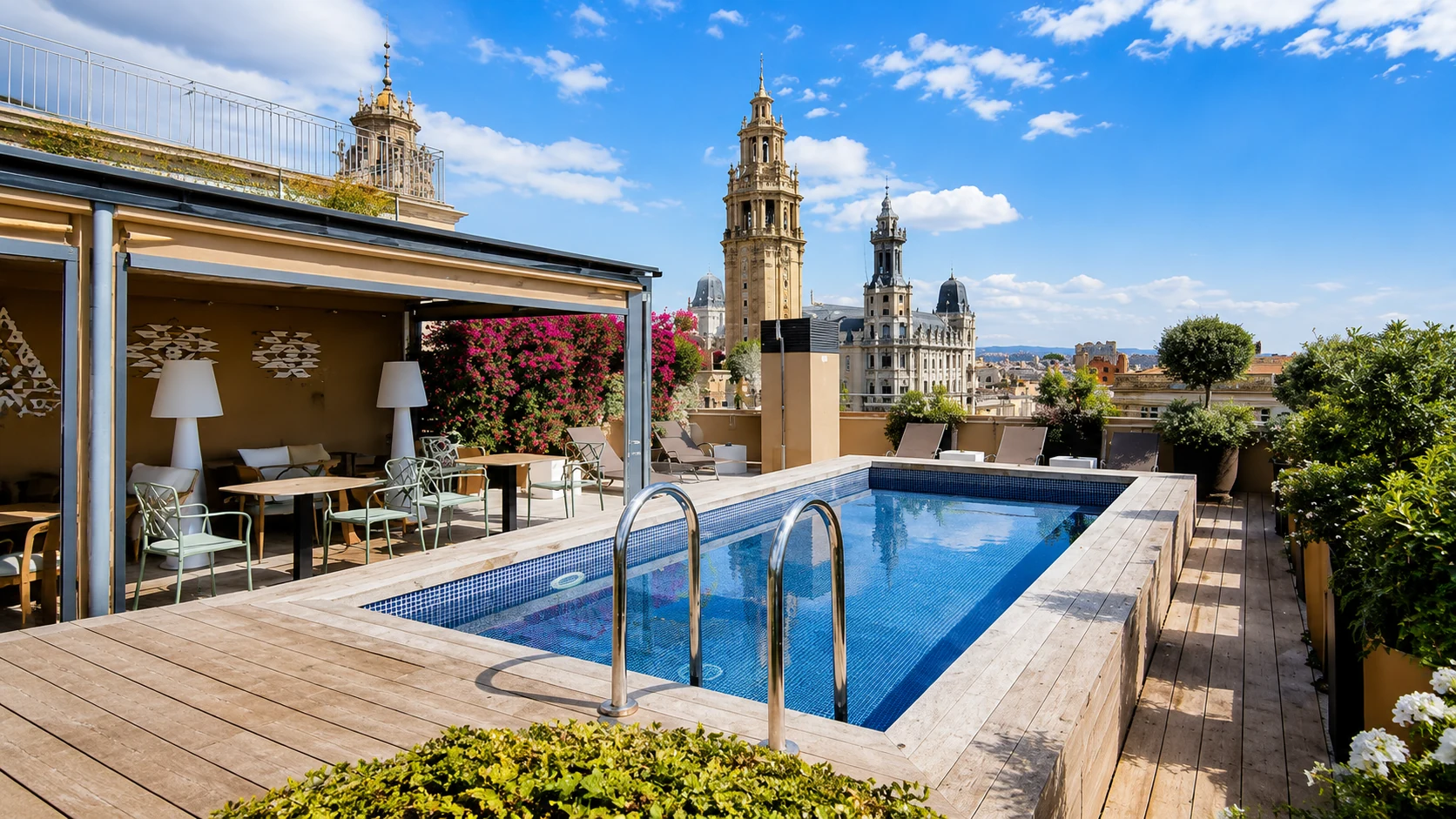 Duquesa de Cardona Barcelona rooftop pool with city views and bright blue sky