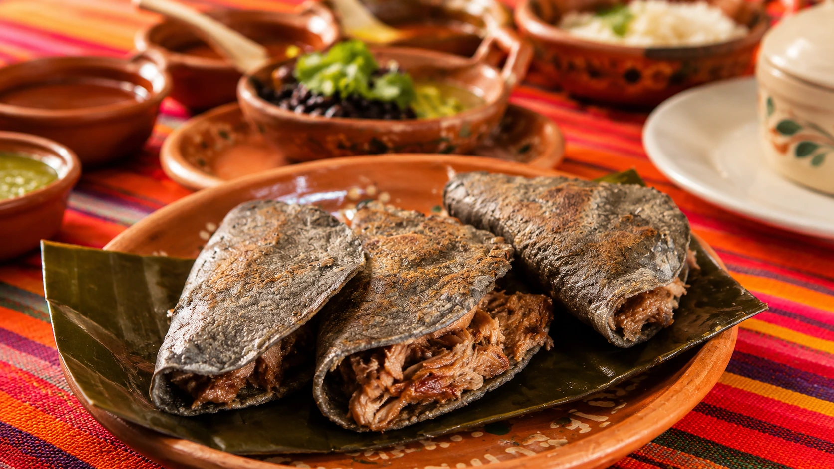 El Hidalguense Mexico City barbacoa, tortillas, salsa, lime, and Mexican side dishes
