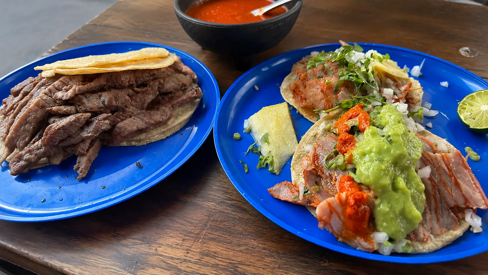 El Vilsito Mexico City tacos with salsa, lime, tortillas, and casual taqueria table