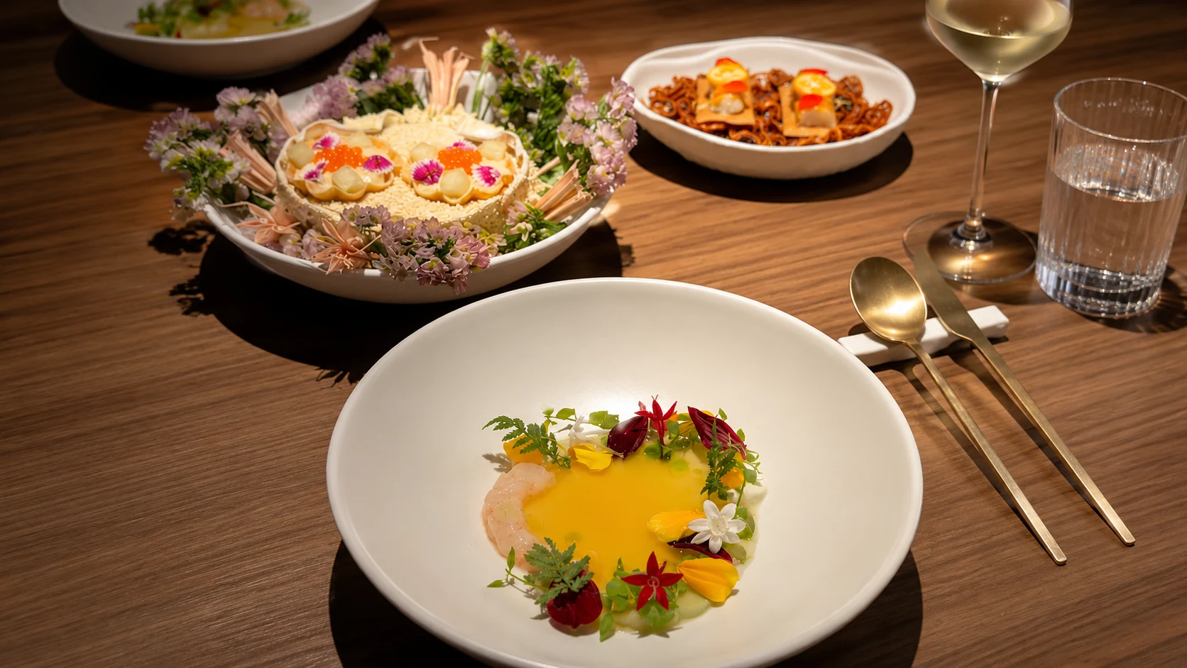 Fishology Barcelona seafood dinner spread with wine, fish, and small plates