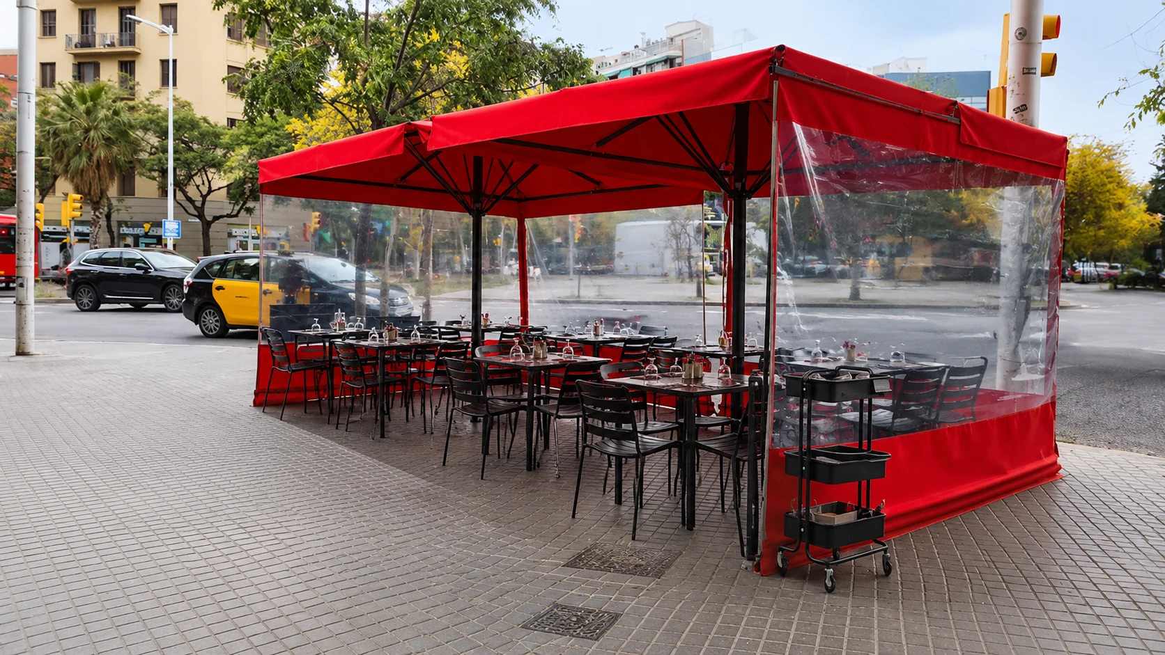 Granja Mabel Barcelona sidewalk terrace with red awning and outdoor tables