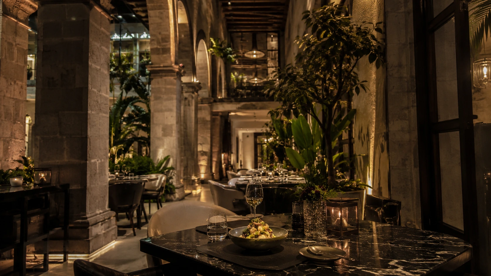 Mexico City fine dining courtyard restaurant with candlelit table and historic architecture