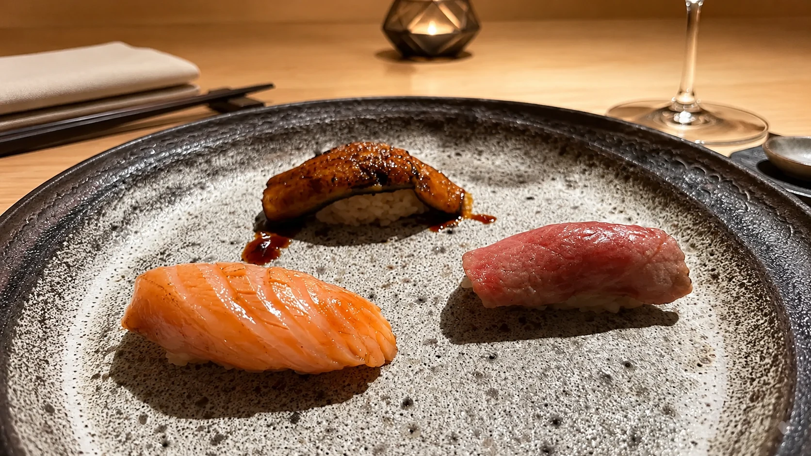 Koy Shunka Barcelona nigiri sushi pieces served on a dark plate