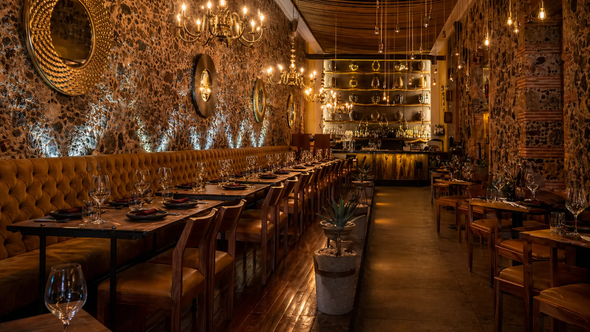 Limosneros Mexico City fine dining restaurant interior with warm lighting and brick walls
