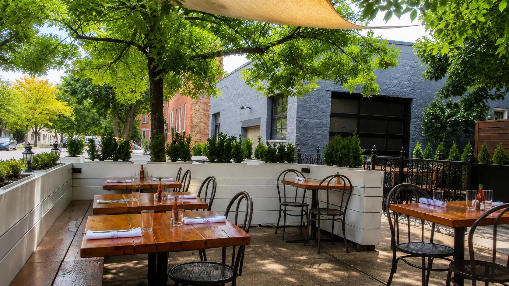 Tree-covered patio at Longman and Eagle in Logan Square Chicago