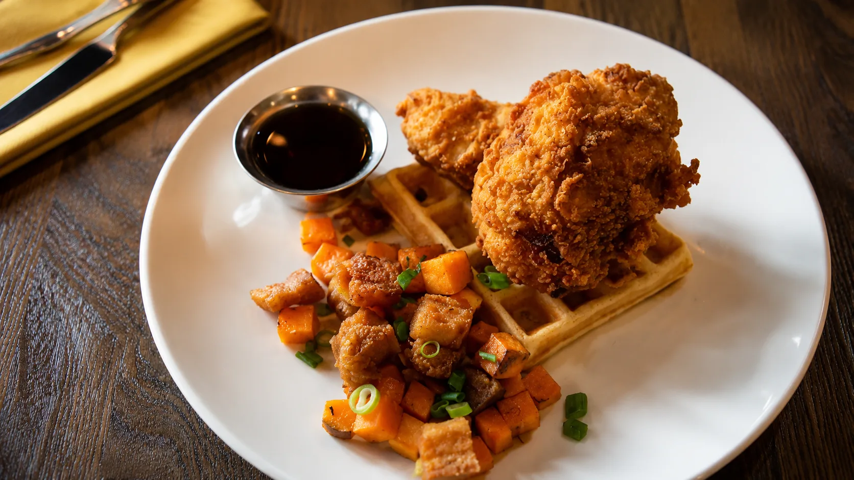 Chicken and waffles with syrup at Longman and Eagle in Chicago