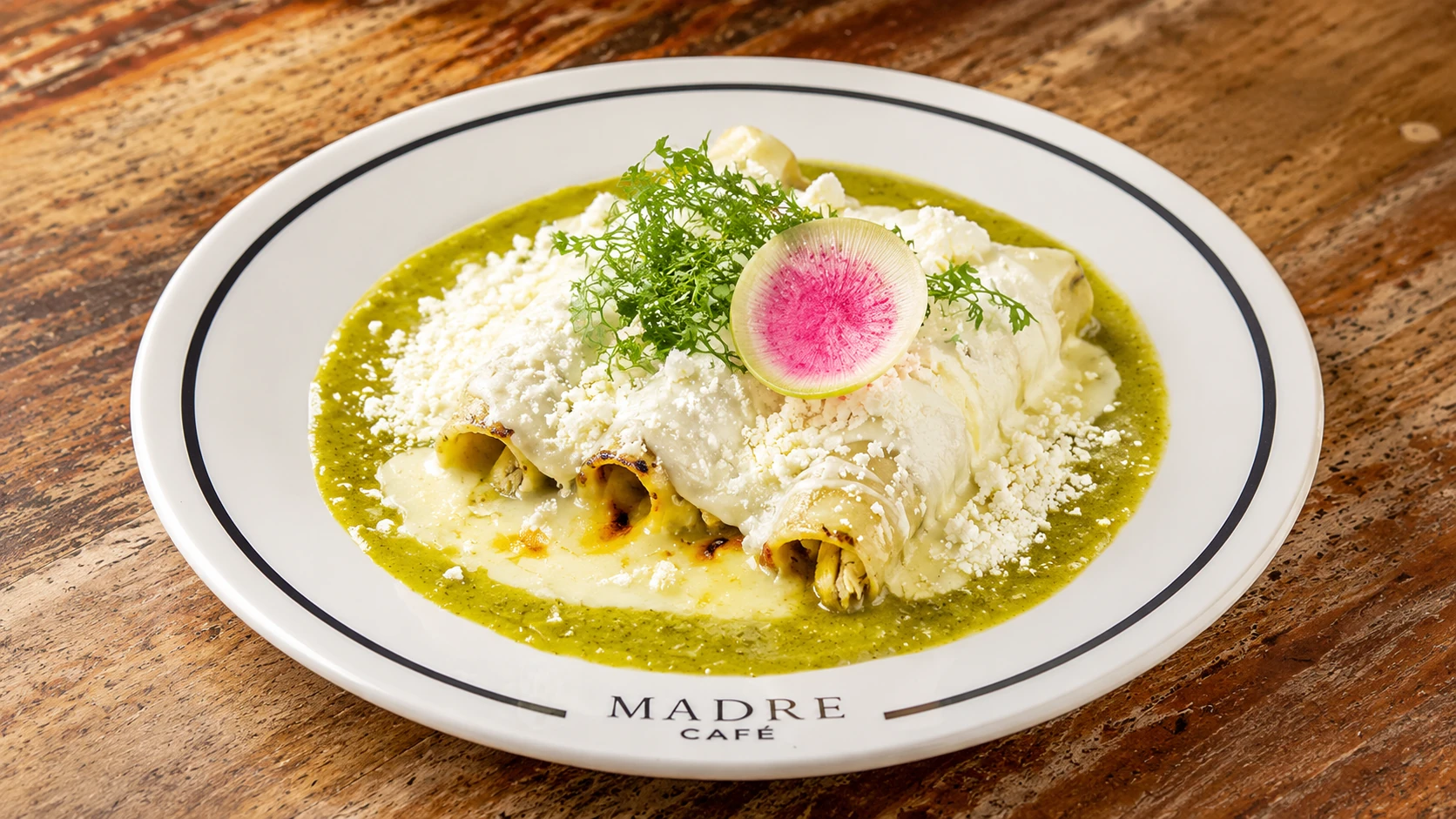 Madre Café Mexico City brunch table with eggs, pastries, coffee, and juice