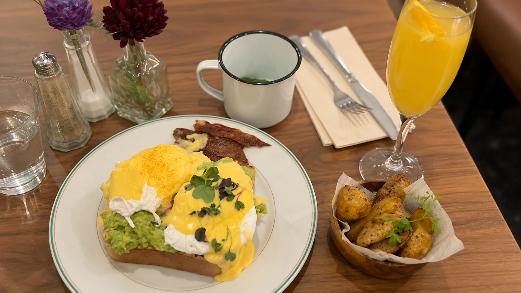 Milk Bar and Bistro Barcelona brunch plate with eggs, toast, greens, and coffee
