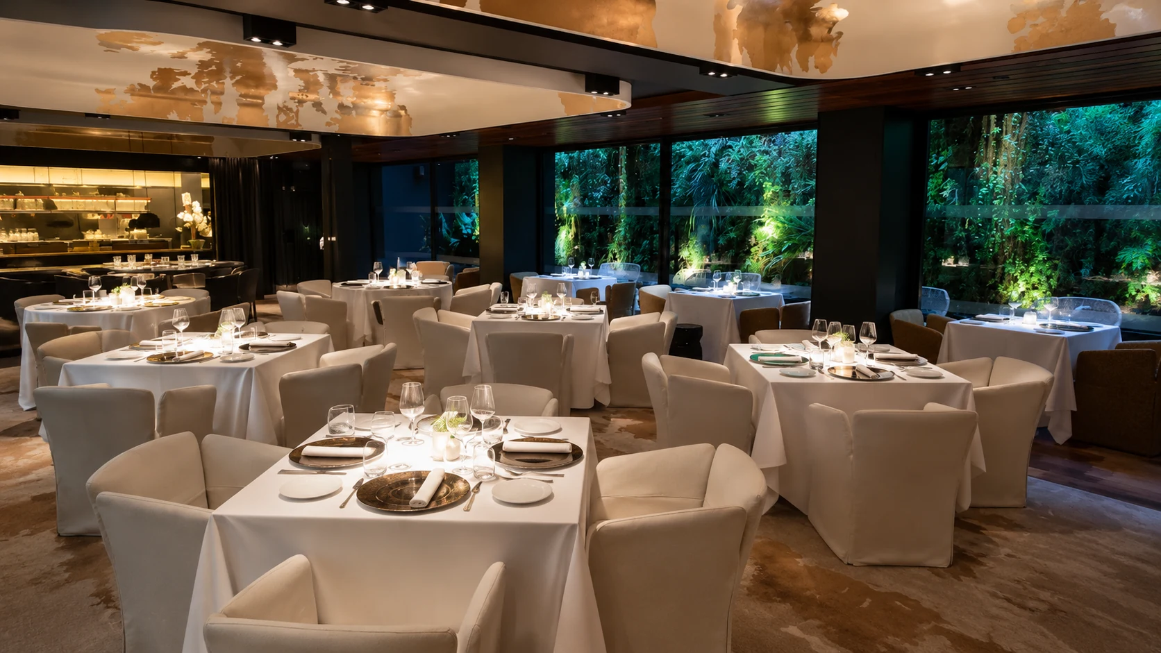 Moments Barcelona fine dining room with elegant tables and warm lighting
