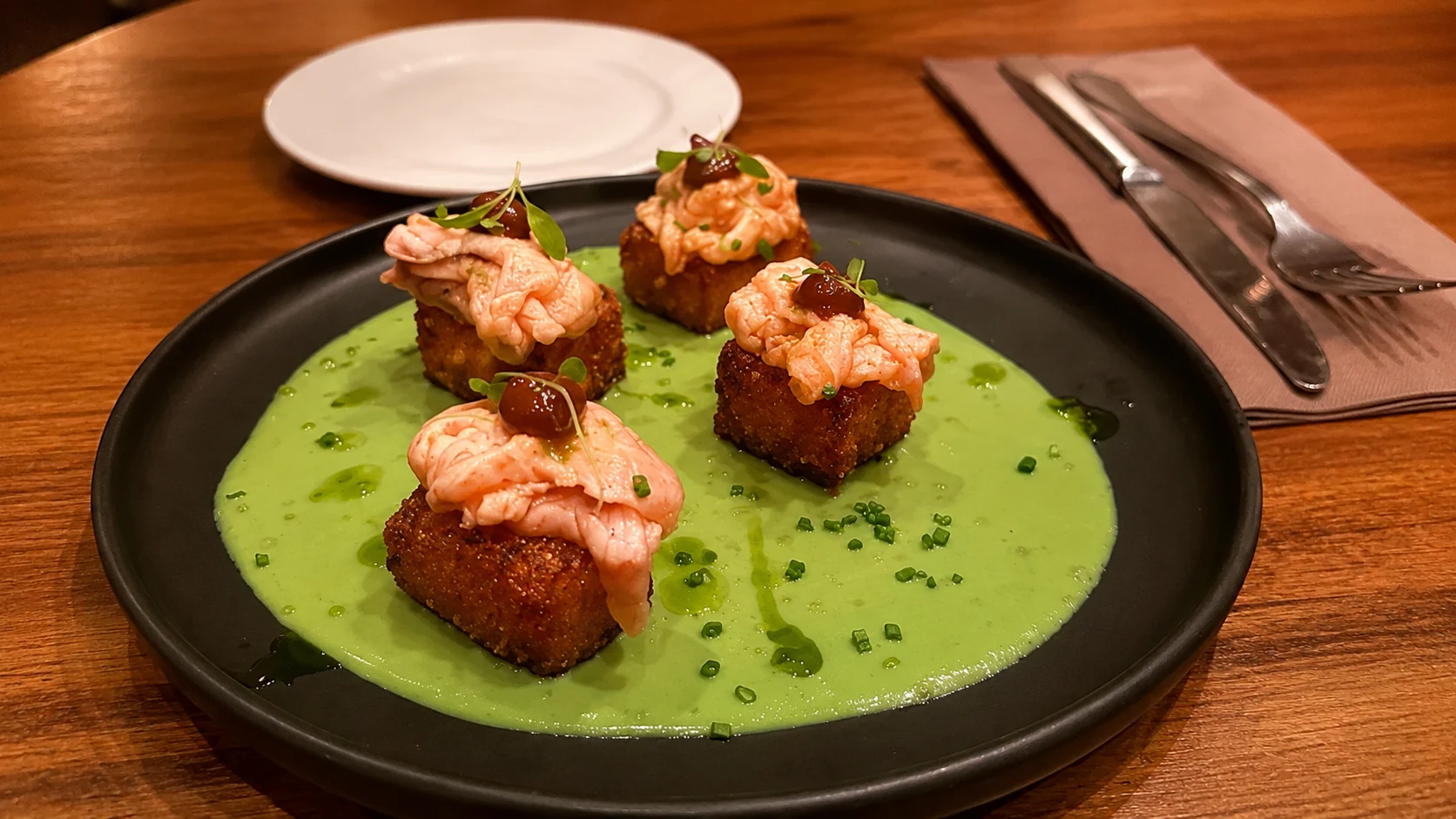 Petit Tapas Barcelona seafood tapas with sauce and garnish