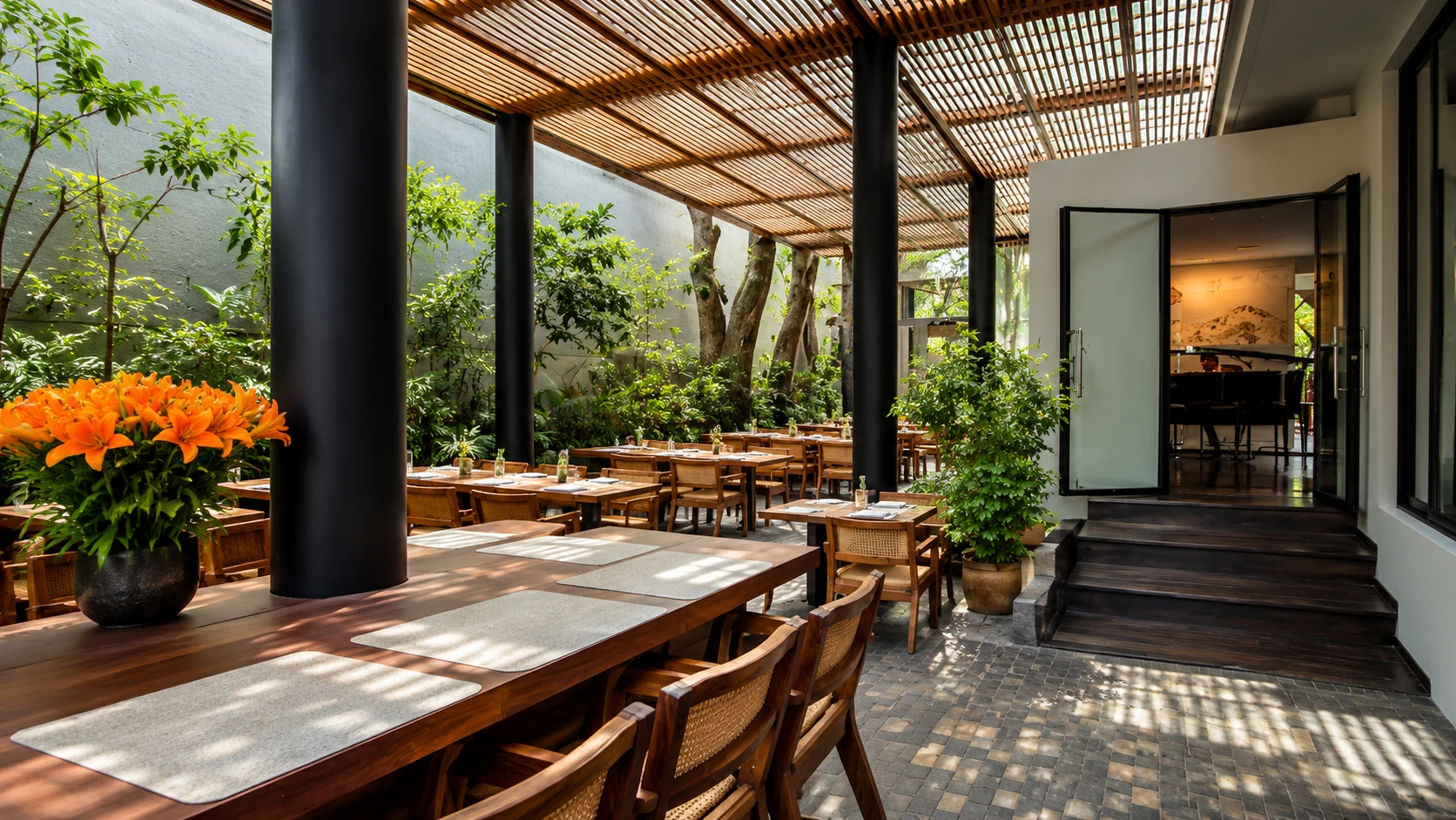 Pujol Mexico City modern restaurant patio with wood tables and garden terrace