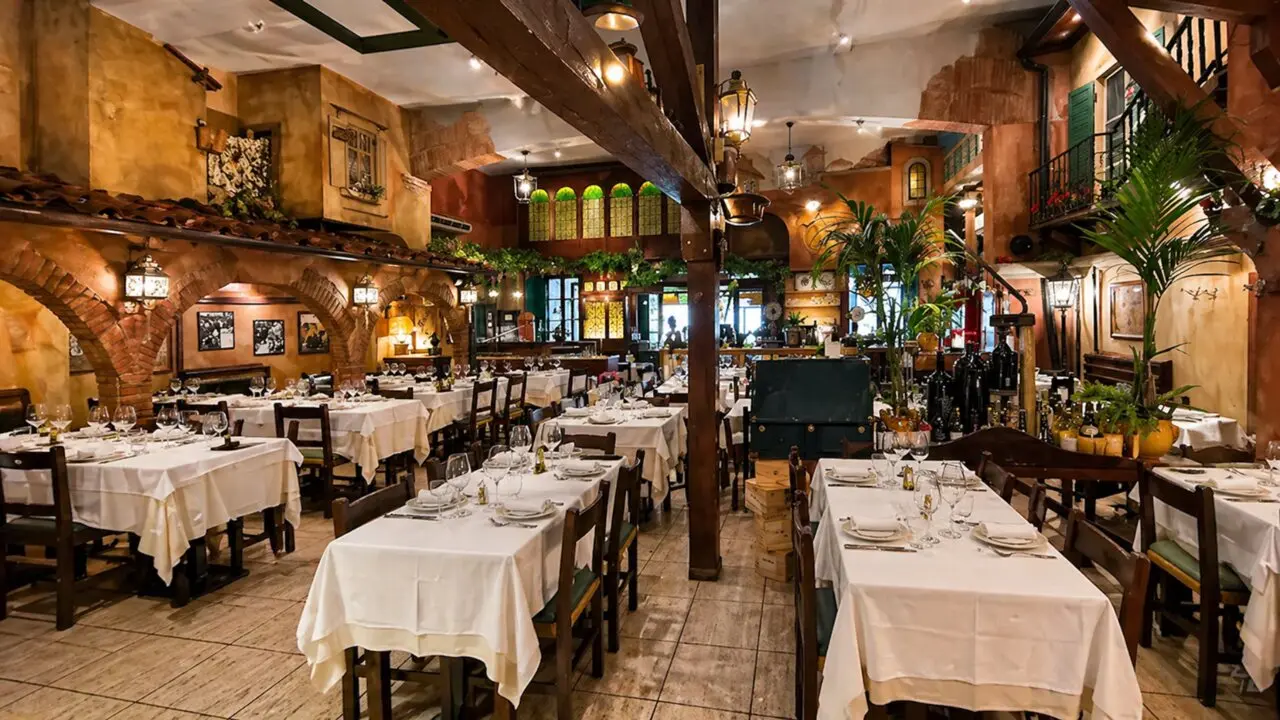 Alla Rampa Rome classic Italian restaurant dining room with white tablecloths