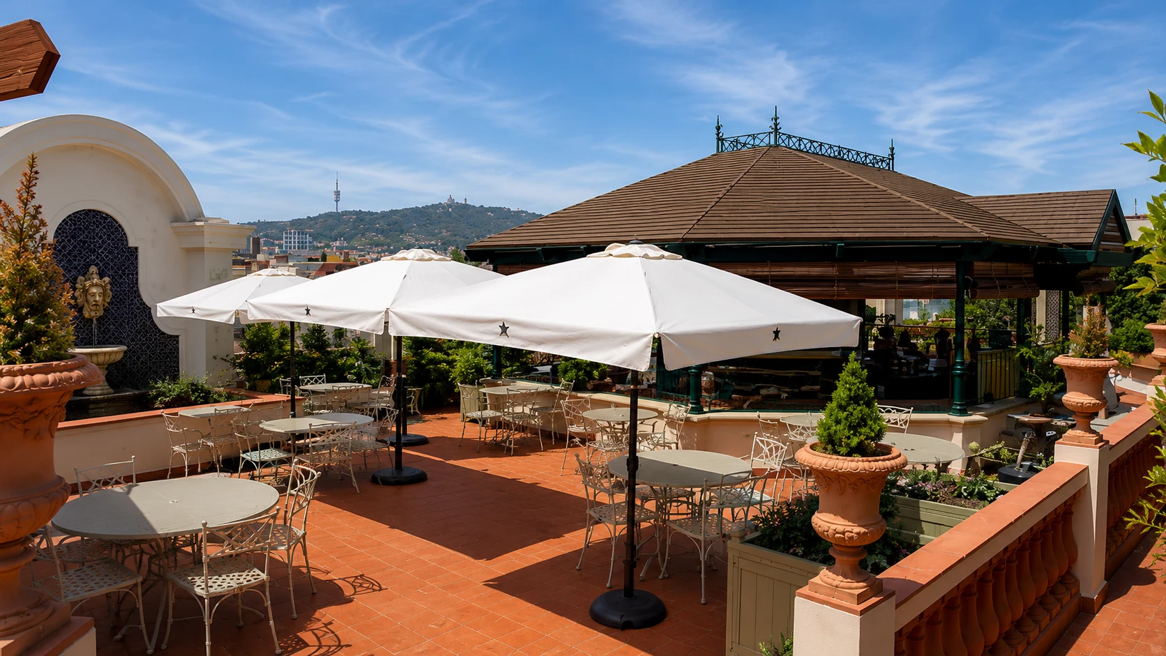 Rooftop Garden at El Palace Barcelona terrace with outdoor seating and plants
