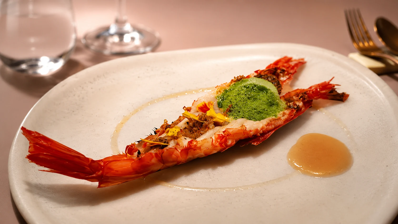 Slow&Low Barcelona seafood dish with sauce and herbs