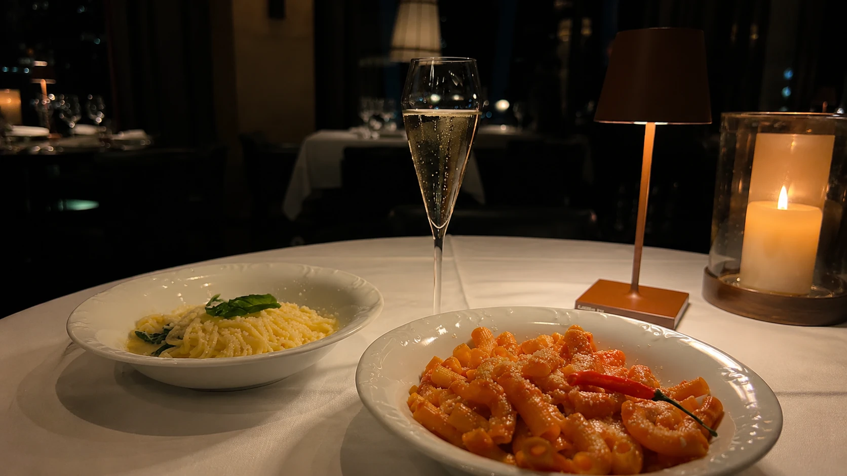 Pasta dishes with candlelight and Champagne at Tre Dita in Chicago