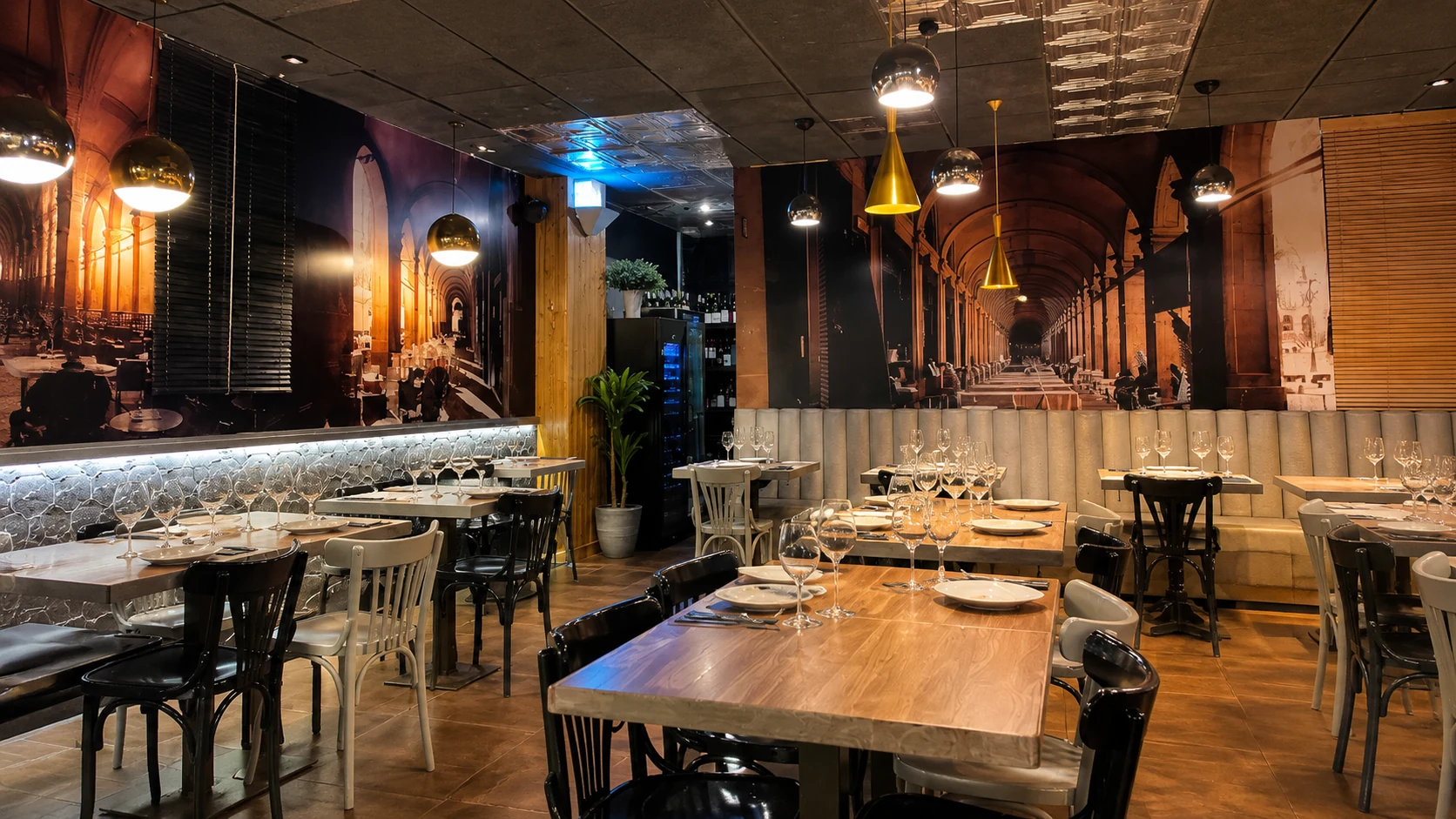 Viana Barcelona restaurant dining room with brick walls and warm lighting